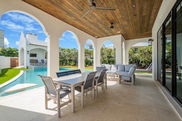 view of patio / terrace featuring a fenced in pool, an outdoor living space, and ceiling fan