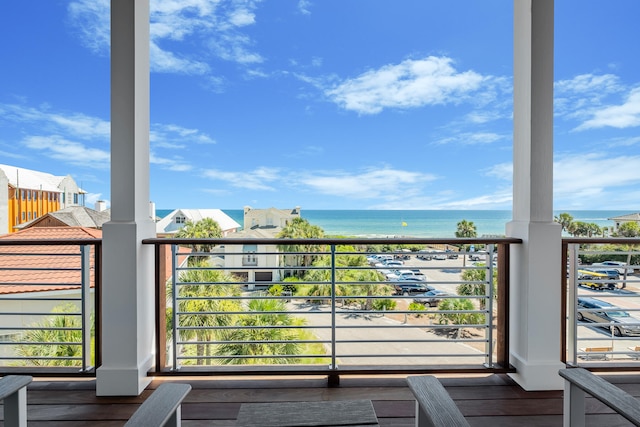 balcony featuring a water view