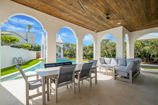 view of patio / terrace with ceiling fan, a fenced in pool, and outdoor lounge area