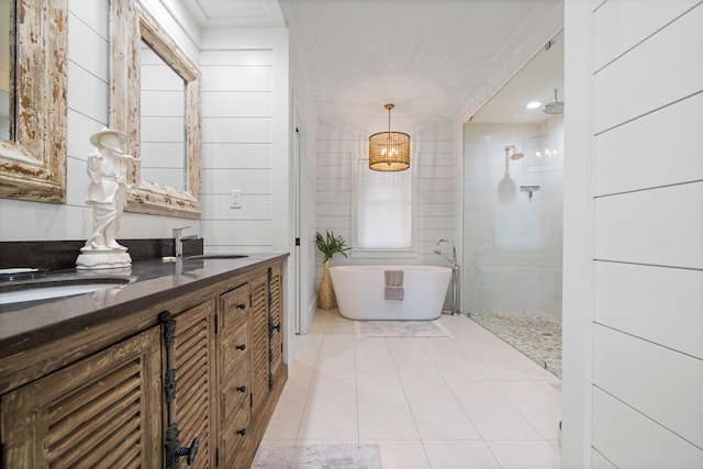 bathroom with tile patterned flooring, vanity, and independent shower and bath