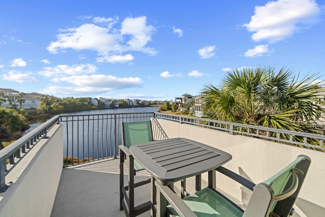 balcony featuring a water view