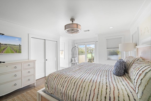 4639 Destiny Way, Destin, FL 32541 - bedroom featuring access to outside, a closet, wood finished floors, recessed lighting, and ornamental molding