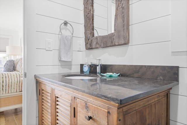 bathroom featuring vanity and hardwood / wood-style flooring