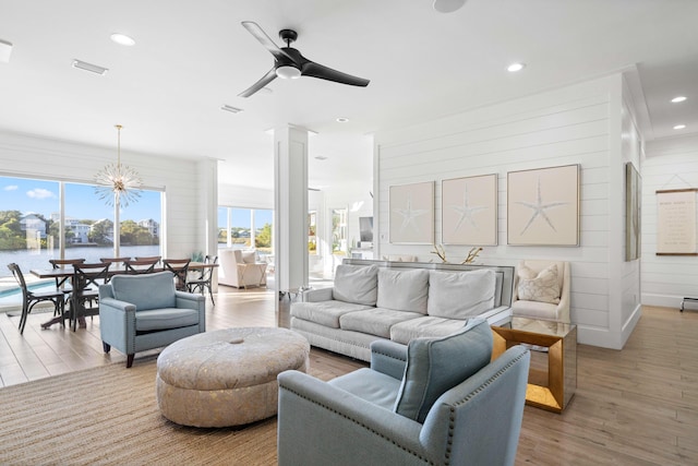 4639 Destiny Way, Destin, FL 32541 - living room featuring wood finished floors, a chandelier, ceiling fan, and recessed lighting