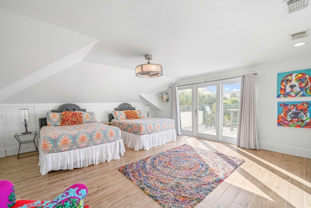 4639 Destiny Way, Destin, FL 32541 - bedroom featuring access to outside, vaulted ceiling, wood finished floors, and baseboards