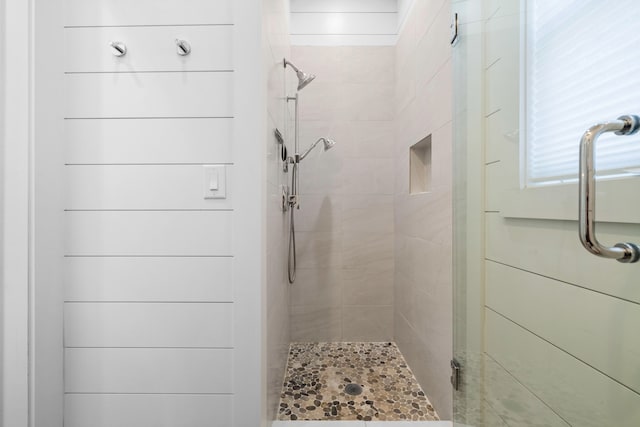 bathroom with a shower with shower door