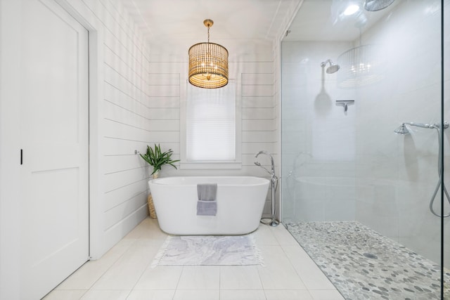 4639 Destiny Way, Destin, FL 32541 - full bath with a tile shower, a freestanding tub, tile patterned flooring, and a chandelier
