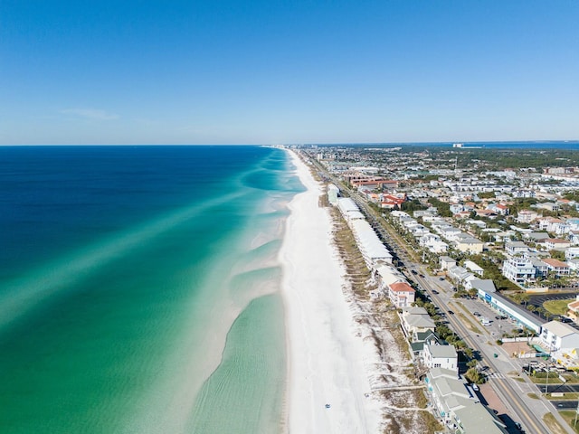 drone / aerial view with a water view and a beach view