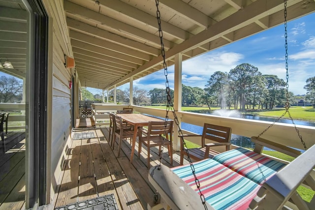 wooden terrace with a water view