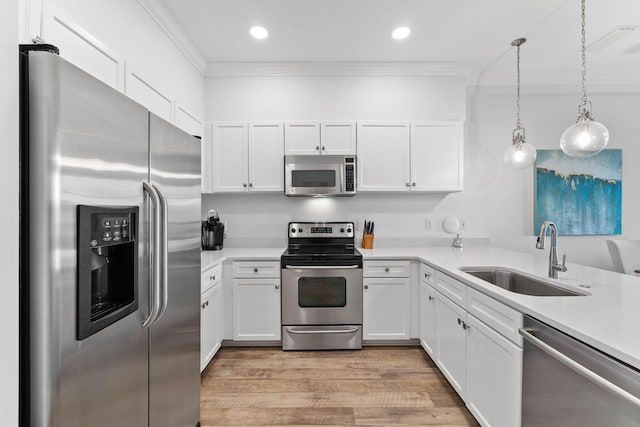 10343 E County Highway 30a Unit 316, Seacrest, FL 32461 - kitchen with stainless steel appliances, a sink, crown molding, white cabinets, and recessed lighting