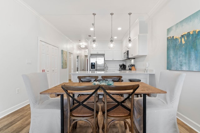 10343 E County Highway 30a Unit 316, Seacrest, FL 32461 - dining room featuring crown molding, baseboards, light wood-type flooring, and recessed lighting