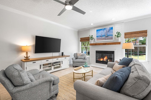 tiled living room with a wealth of natural light, a textured ceiling, and crown molding