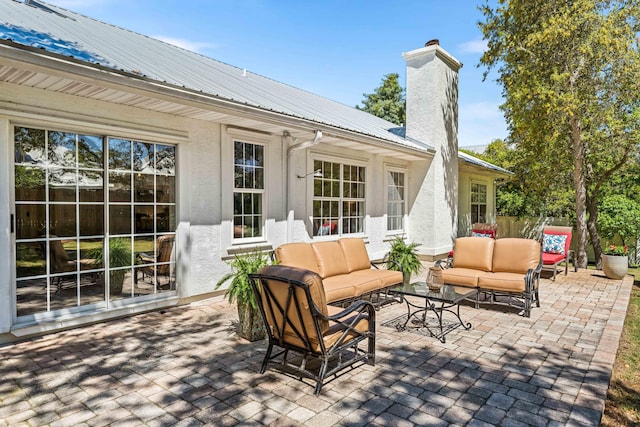 view of patio / terrace with an outdoor living space and fence
