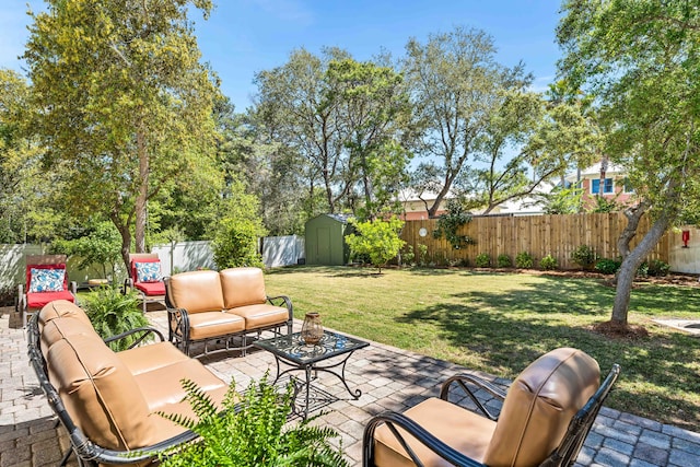 view of patio / terrace featuring outdoor lounge area, a storage shed, and an outdoor structure