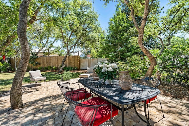 view of patio / terrace featuring fence and outdoor dining area