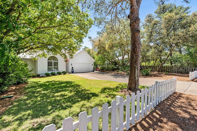 view of front facade with a garage and a front yard