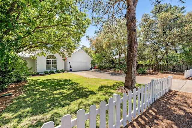 view of front of home featuring concrete driveway, stucco siding, and a garage