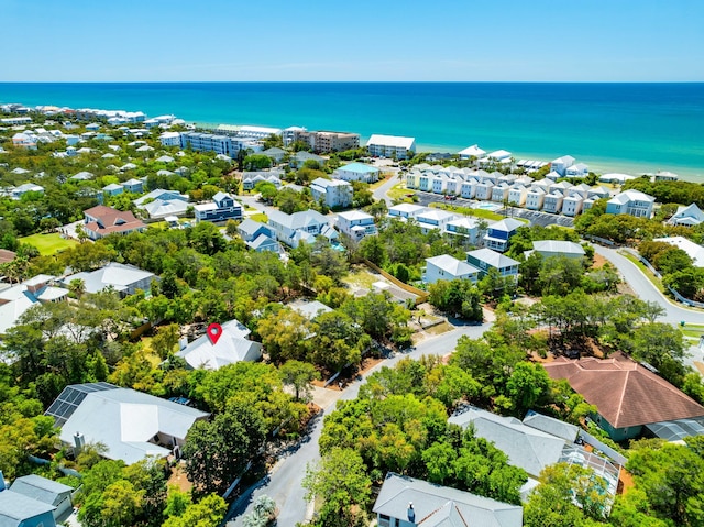 aerial view of residential area with a nearby body of water