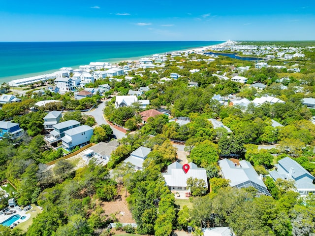aerial view of residential area featuring a nearby body of water