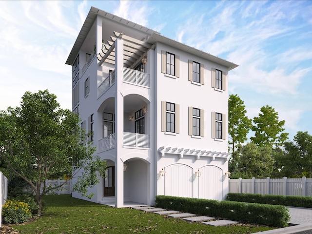 view of front facade featuring a front yard and a balcony