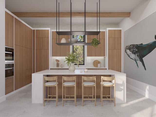 kitchen with beam ceiling, a large island, stainless steel double oven, pendant lighting, and decorative backsplash