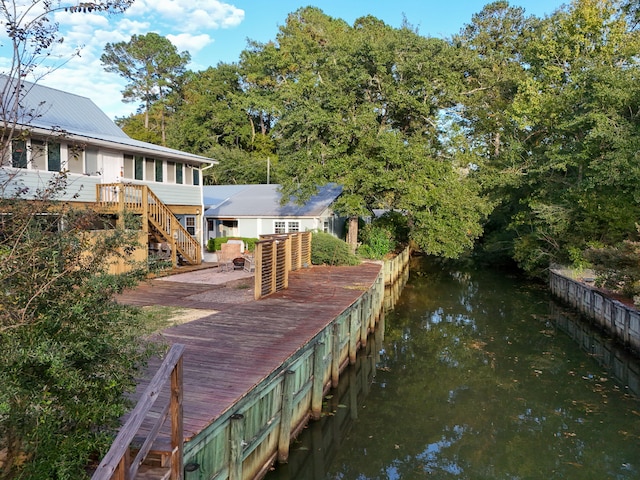 dock area featuring a deck with water view