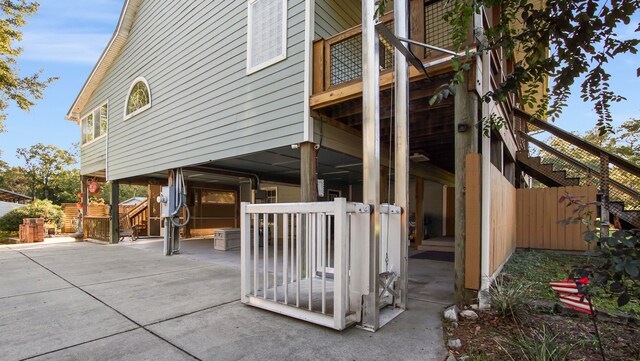 view of side of home with a patio area