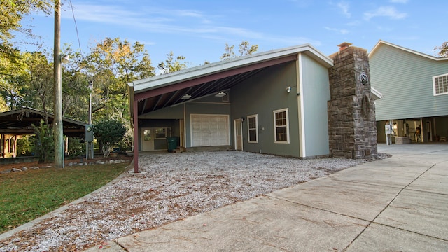 view of side of home featuring a carport