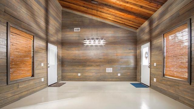 entryway featuring wooden walls