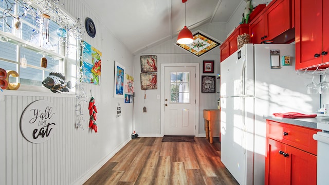 doorway to outside with dark wood-type flooring and lofted ceiling