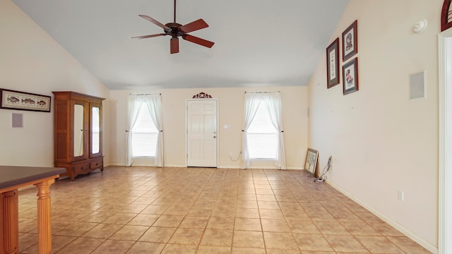 interior space with high vaulted ceiling, a wealth of natural light, and ceiling fan