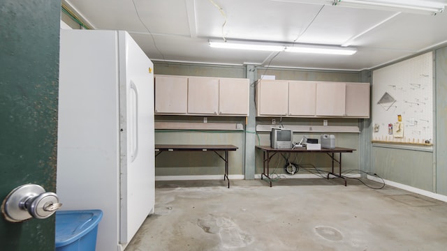 basement with white fridge