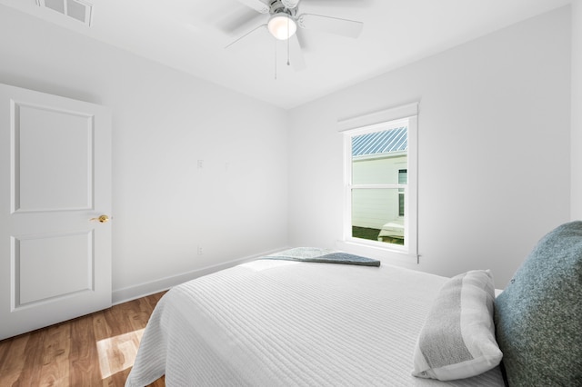 bedroom featuring wood-type flooring and ceiling fan