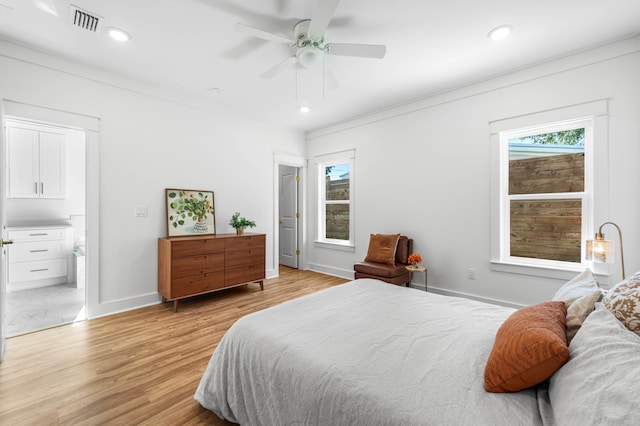 bedroom with ceiling fan, light hardwood / wood-style flooring, and crown molding