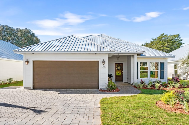 modern farmhouse style home with a garage and a front yard