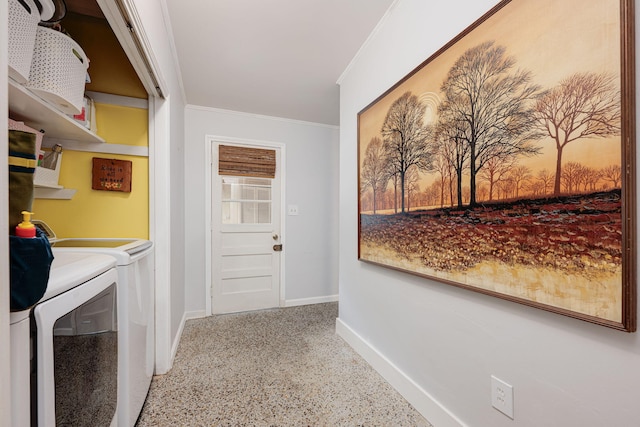 washroom with washer and dryer and ornamental molding