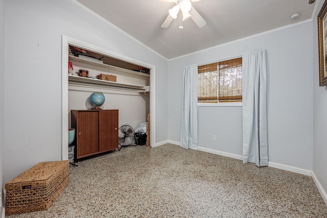 bedroom featuring ceiling fan, lofted ceiling, crown molding, and a closet