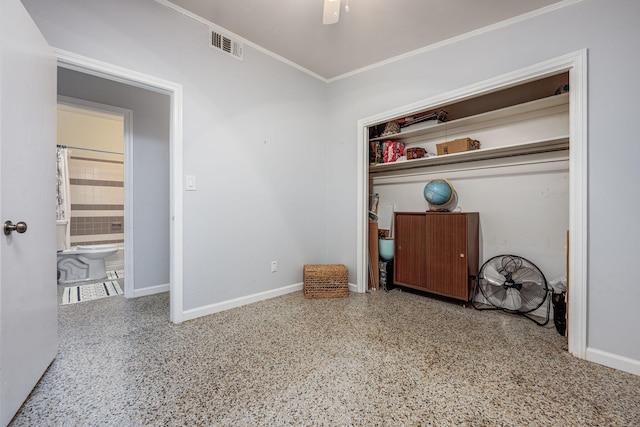 unfurnished bedroom featuring ceiling fan and crown molding