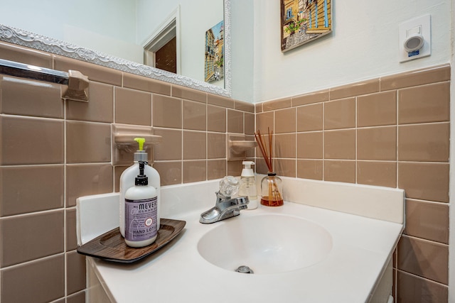 bathroom with sink and tile walls