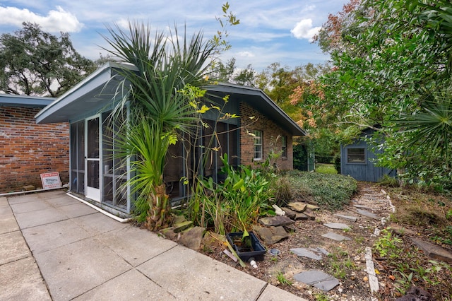 view of home's exterior with a shed