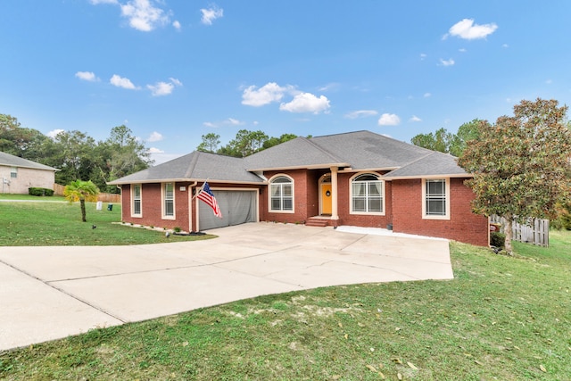 ranch-style home with a garage and a front lawn