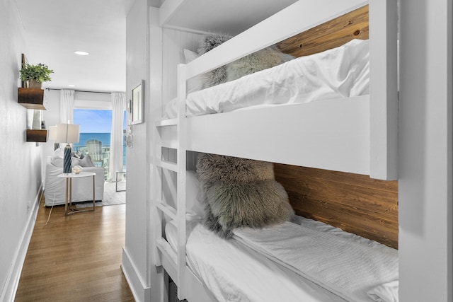 bedroom with dark wood-type flooring