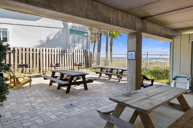 view of patio with a water view