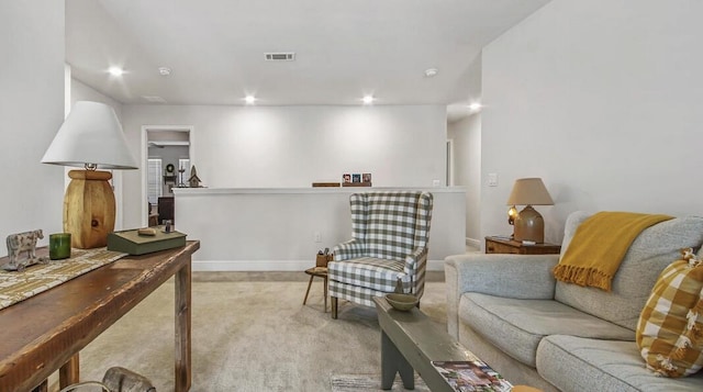 sitting room featuring baseboards, recessed lighting, visible vents, and light colored carpet