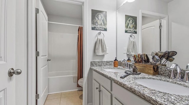 bathroom featuring double vanity, shower / tub combo, tile patterned flooring, and a sink