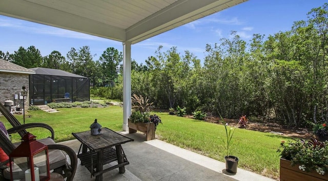 view of patio with glass enclosure