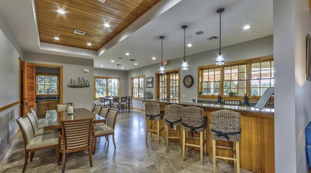 dining room featuring a tray ceiling, wooden ceiling, visible vents, and recessed lighting