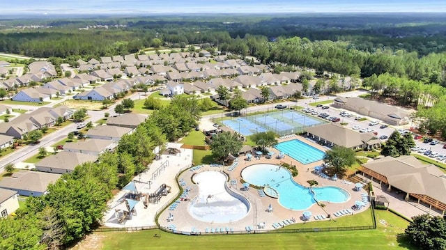 drone / aerial view featuring a forest view