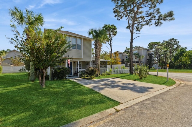 view of front of house with a front yard and a porch