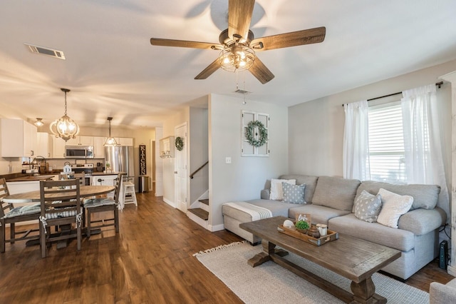 living room with dark wood-type flooring, sink, and ceiling fan